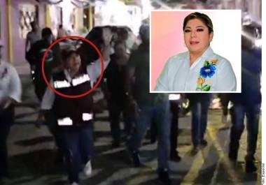 La candidata y otra persona que también murió en el lugar quedaron tendidas en la calle y sus cuerpos fueron cubiertos con banderas de Morena.